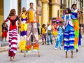 Colorful street dancers on stilts in Old Havana