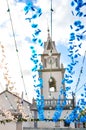 Colorful street decoration hanging on the street in front of the Roman Catholic church in Loreto, Madeira, Portugal. Portuguese Royalty Free Stock Photo