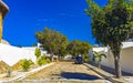 Colorful street with houses palms cars restaurants Puerto Escondido Mexico Royalty Free Stock Photo