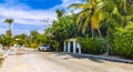 Colorful street with houses palms cars restaurants Puerto Escondido Mexico Royalty Free Stock Photo