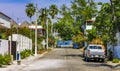 Colorful street with houses palms cars restaurants Puerto Escondido Mexico Royalty Free Stock Photo