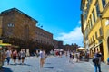 Colorful street in middle of Florence, Italy, with Palazzo Pitti (Pitti Palace) at background Royalty Free Stock Photo