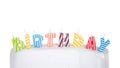 Birthday candles on white cake isolated Royalty Free Stock Photo