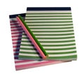 Colorful striped notepads and pencils