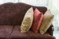 Colorful striped pillows on red sofa in luxury living room Royalty Free Stock Photo