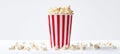 The colorful striped popcorn container filled with fresh, crunchy popcorn. AI generated image Royalty Free Stock Photo