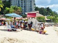 Colorful Striped Umbrellas Providing Protection From the Sun at the Beach Royalty Free Stock Photo