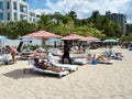 Colorful Striped Umbrellas Providing Protection From the Sun at the Beach Royalty Free Stock Photo