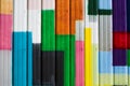 Colorful strips fill metal container wall