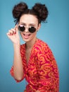 Colorful Studio portrait of beautiful young woman posing in sunglasses Royalty Free Stock Photo