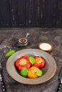 Colorful stuffed peppers with rice and minced meat on wooden background Royalty Free Stock Photo