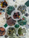 Colorful and stylish gemstones on a Southeast Asian market. Valuable stones close up shot on a market. Stylish ring and locket