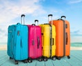 Beautiful Colorful suitcases on wooden background