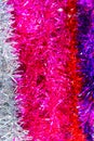 Colorful Sukkot or Sukkos or Christmas tinsel. New year`s fluffy gold, purple, silver, yellow, pink tinsel. Royalty Free Stock Photo