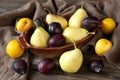 Colorful summer fruits -plums and pears on wooden table Royalty Free Stock Photo