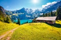 Colorful summer morning on the unique Oeschinensee Lake. Splendid outdoor scene in the Swiss Alps with Bluemlisalp mountain, Kande