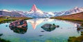 Colorful summer panorama of the Stellisee lake. Few minutes before sunrise.