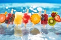 Colorful summer refreshing fruit ice with strawberry, kiwi, blueberry, pineapple, raspberry in sparkling water in pool Royalty Free Stock Photo