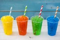 Colorful summer slushies on blue wood Royalty Free Stock Photo