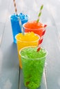 Colorful summer slushies on blue wood Royalty Free Stock Photo