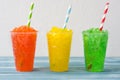 Colorful summer slushies on blue wood Royalty Free Stock Photo