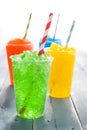 Colorful summer slushies on blue wood Royalty Free Stock Photo