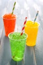 Colorful summer slushies on blue wood Royalty Free Stock Photo