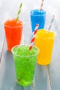 Colorful summer slushies on blue wood Royalty Free Stock Photo