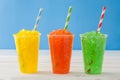 Colorful summer slushies on blue wood Royalty Free Stock Photo