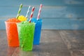 Colorful summer slushies on blue wood Royalty Free Stock Photo