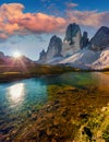 Colorful summer sunrise on the lake Rienza