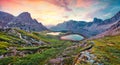 Colorful summer sunrise in rocky mountain valley. Fantastic morning scene of Tre Cime di Lavaredo National park with Laghi del