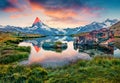 Colorful summer sunrise on the Stellisee lake.