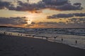 Colorful summer sunset on the Baltic sea by the gulls on the beach