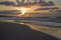 Colorful summer sunset on the Baltic sea by the gulls on the beach