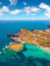 Colorful summer view from flying drone of Falcone cape and Torre della Pelosa tower.