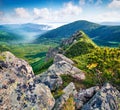 Colorful summer view of foggy Carpathian mountains, Chornogora ridge, Ukraine, Europe. Amazing morning scene of rocky mountains. B