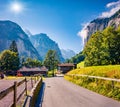 Colorful summer view of Lauterbrunnen village with asphalt road. Bright outdoor scene in Swiss Alps, Bernese Oberland in the canto