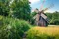 Colorful summer view of traditional romanian windmill. Sunny rural scene of Transylvania, Romania, Europe. Beauty of countryside Royalty Free Stock Photo