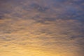 Colorful sunrise cloudscape background with vibrant yellows, ora