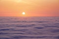 Colorful sunrise high in the heaven above clouds