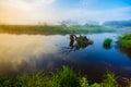 Colorful sunrise landscape. Old dry snag lying in river Royalty Free Stock Photo