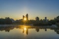 Colorful Sunrise Over La Defense Business District Reflections Lake and Trees Buildings Royalty Free Stock Photo