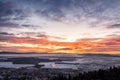 Colorful sunrise over small town Kranj and mountains in the distance in wintertime Royalty Free Stock Photo