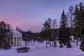 Colorful sunrise in the park of the city of Pavlovsk overlooking the Temple of Friendship and the Slavyanka River