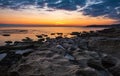 Colorful sunrise on the rocky sea coast Royalty Free Stock Photo