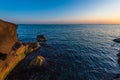 Colorful sunrise on the rocky sea coast Royalty Free Stock Photo