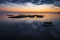 Colorful sunrise on the rocky sea coast, long exposure Royalty Free Stock Photo