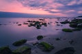 Colorful sunrise on rocky sea coast, long exposure Royalty Free Stock Photo