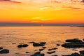 Colorful sunrise on the rocky sea coast Royalty Free Stock Photo